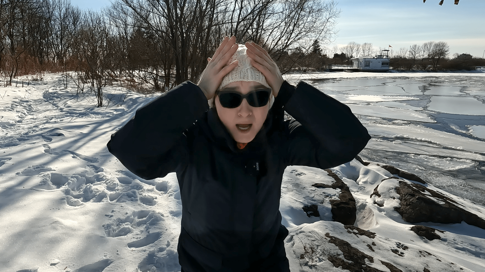 Agnieszka holds her head with an anxious expression on her face