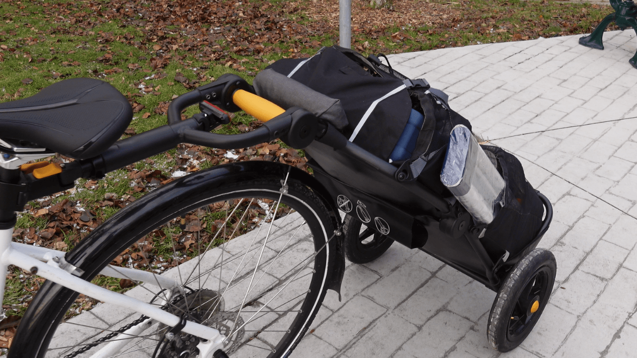 a loaded burley travoy trailer hitched up to a bicycle